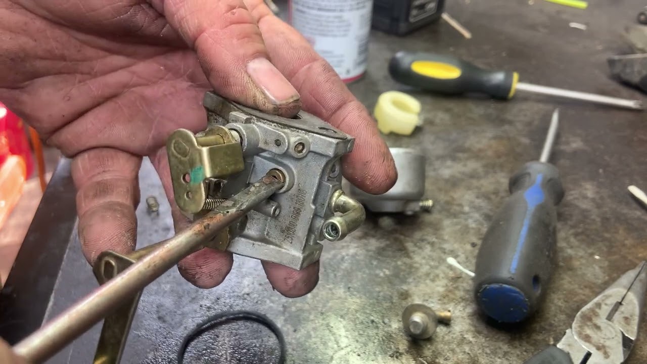Earthquake tiller carb repair.