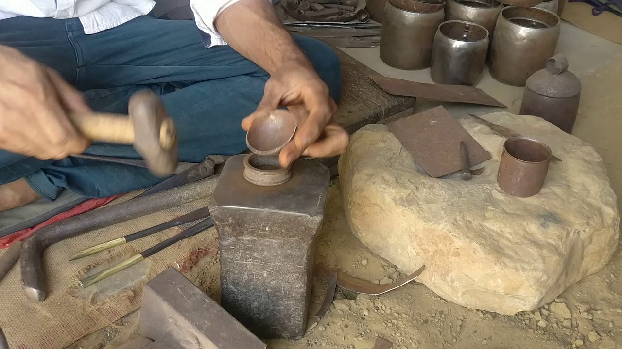 Hand beaten copper bell making- artisan from Nirona, Kutch
