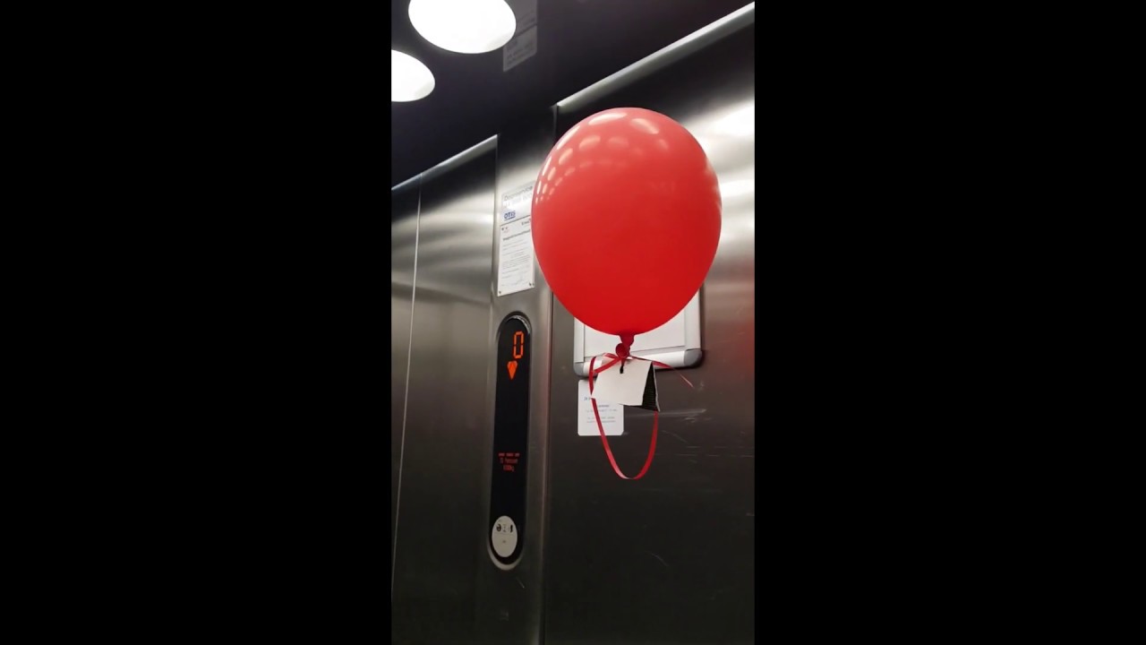 Physics experiment. A floating balloon in a moving elevator.