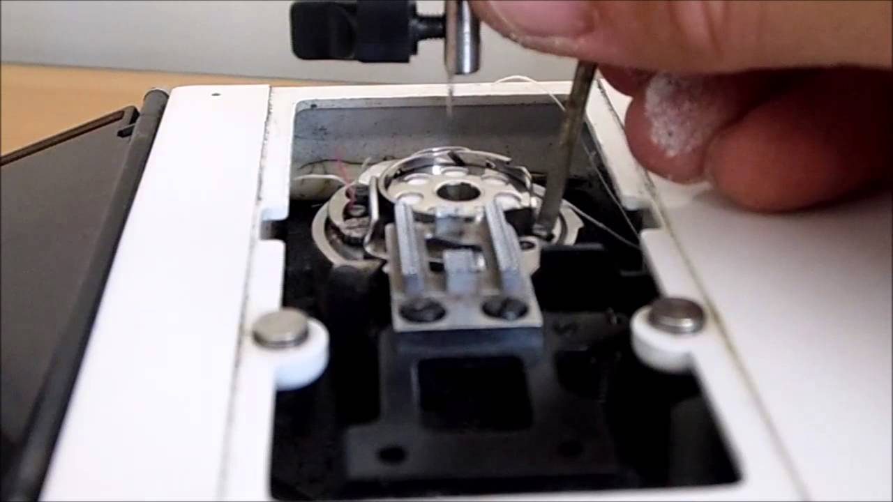 Elna Lotus SP  bobbin case repair  - Removing a cotton jam from a Elna Sewing machine