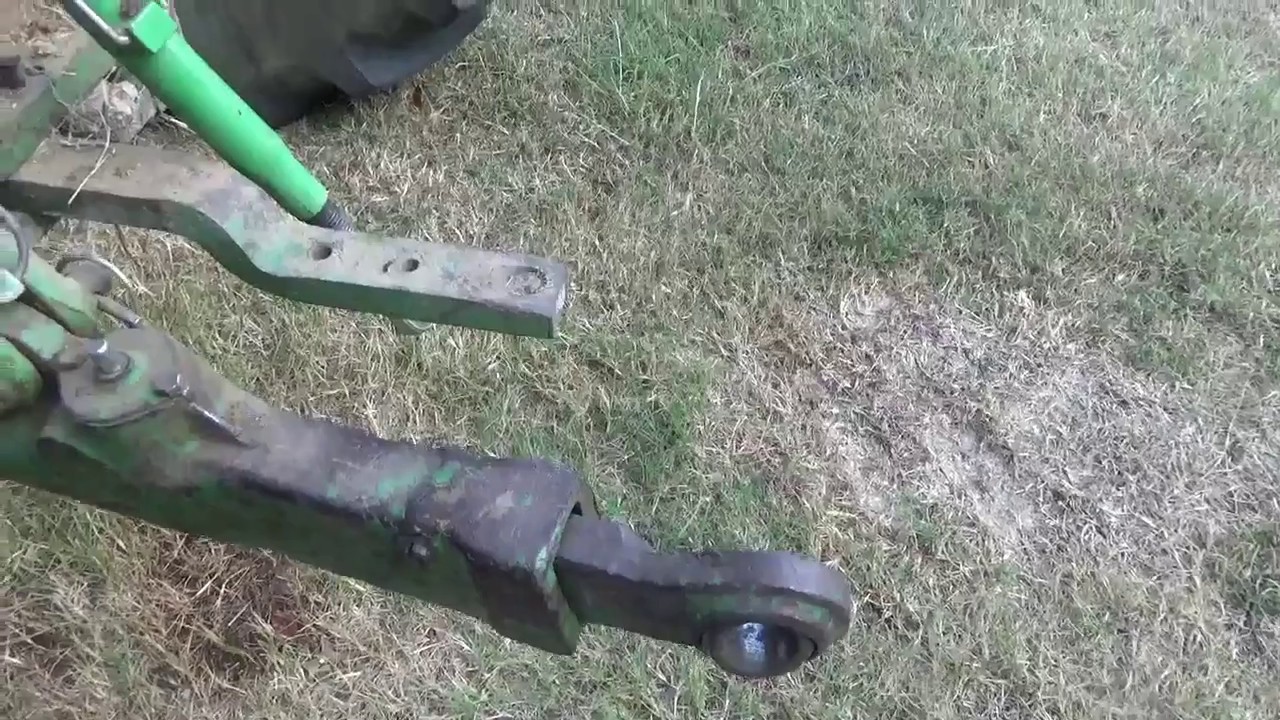Working on the tractor draft arms