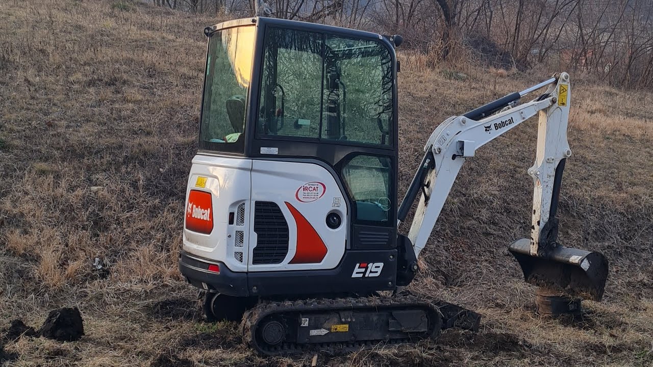 Bobcat e19 leveling a yard