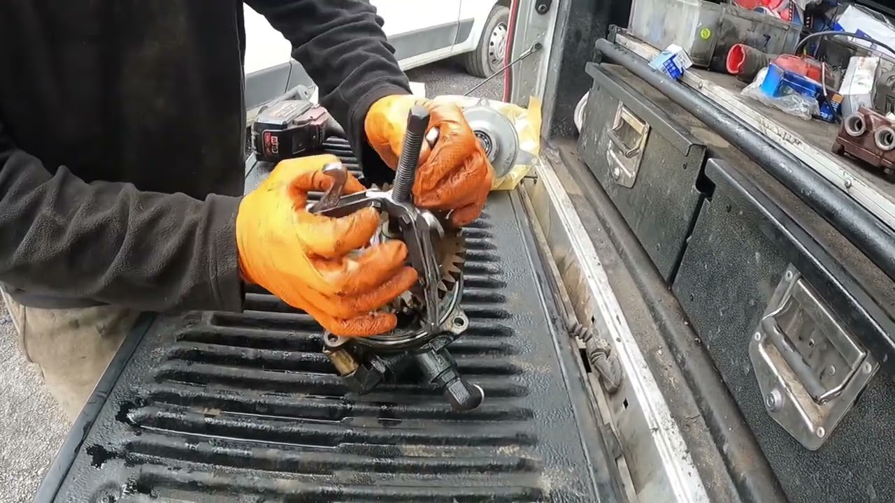 HGV diesel mechanic changing power steering pump and air dryer on Volvo FH aka Troker