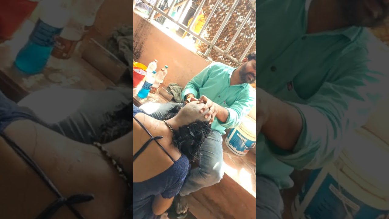 blue Sari Lady headshave Hindu temple