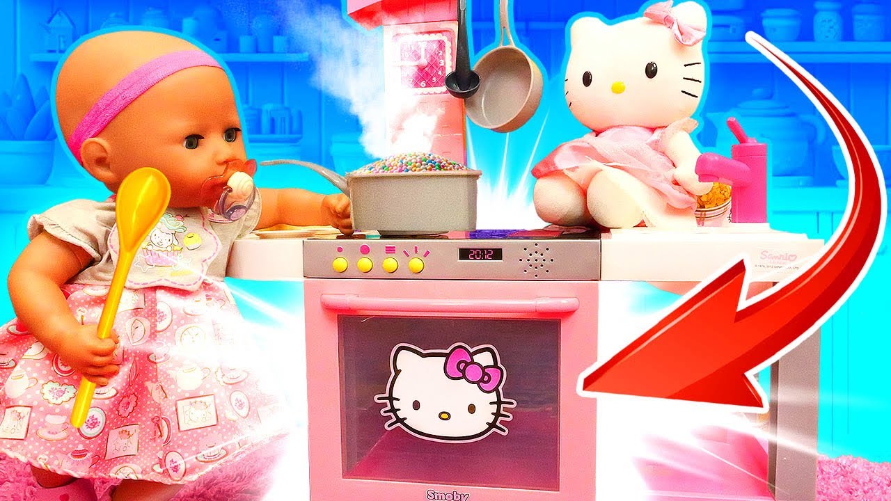 Baby Annabell doll pretends to cook toy food for a toy little kitten. Kitchen adventures!