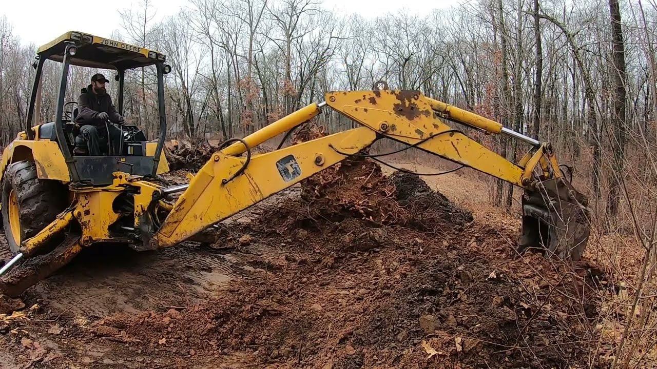 John Deere 410 oak stump removal