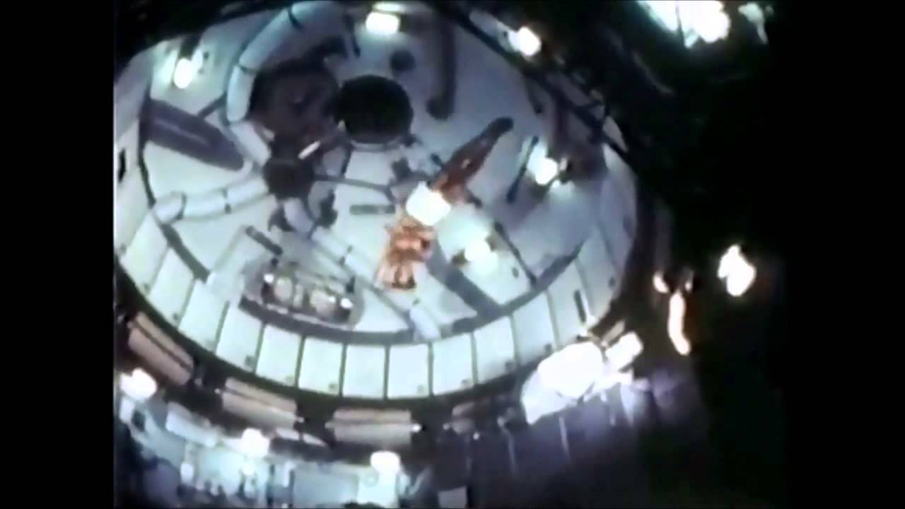 NASA astronauts performing gymnastics on board of the Skylab