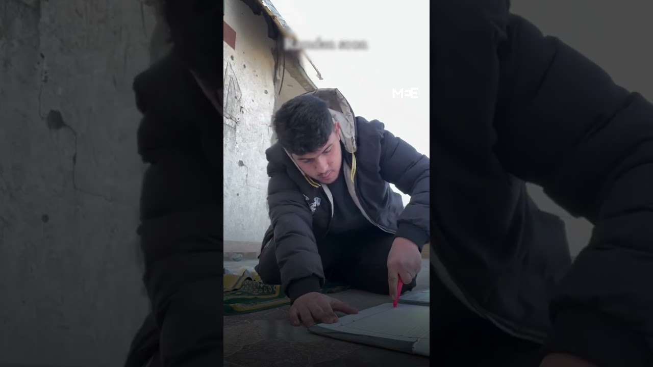 Palestinian man makes Ramadan lights from aid boxes