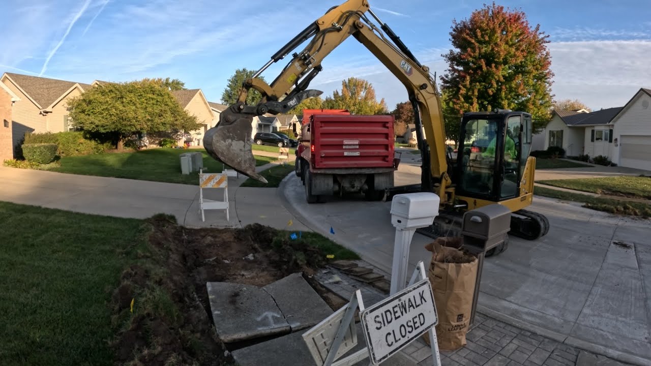 Ripping out Concrete Sidewalk with CAT 306 Mini Excavator