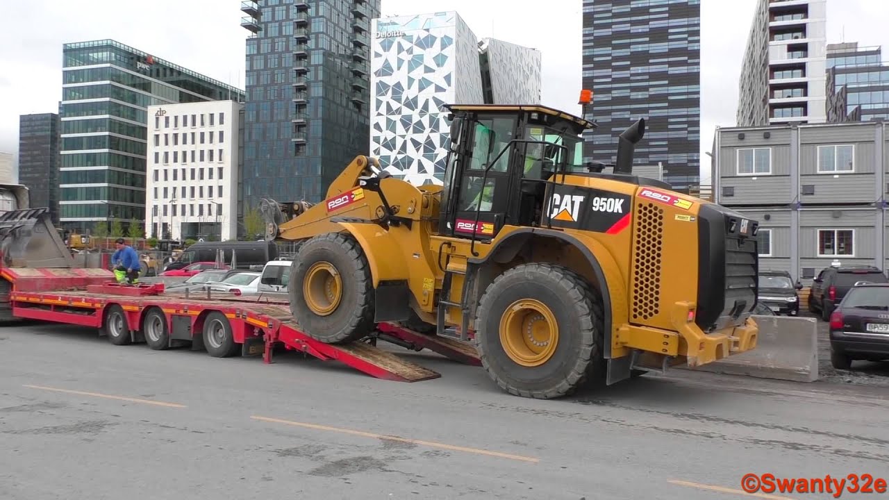 Caterpillar 950K Wheel Loader Gets Loaded on a Scania R730