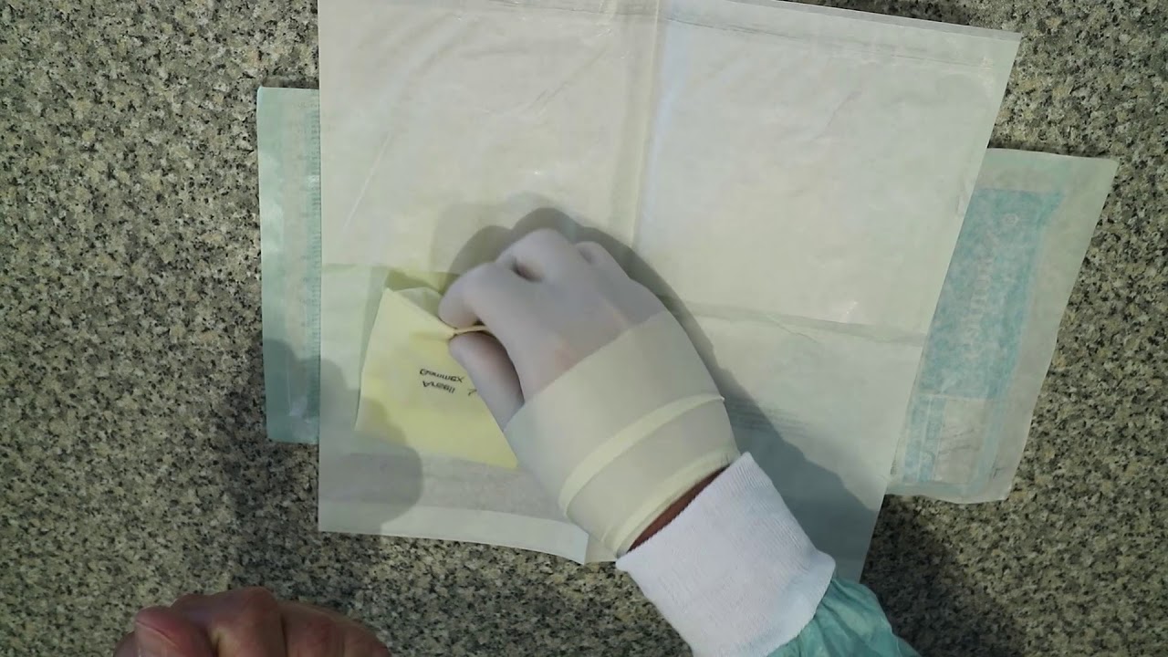 Basic techniques in veterinary surgery - open gloving