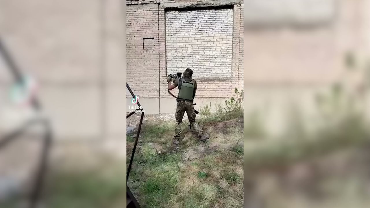 Ukrainian soldier fires with Milkor M32A1 MSGL 40mm Multi Shot Grenade Launcher