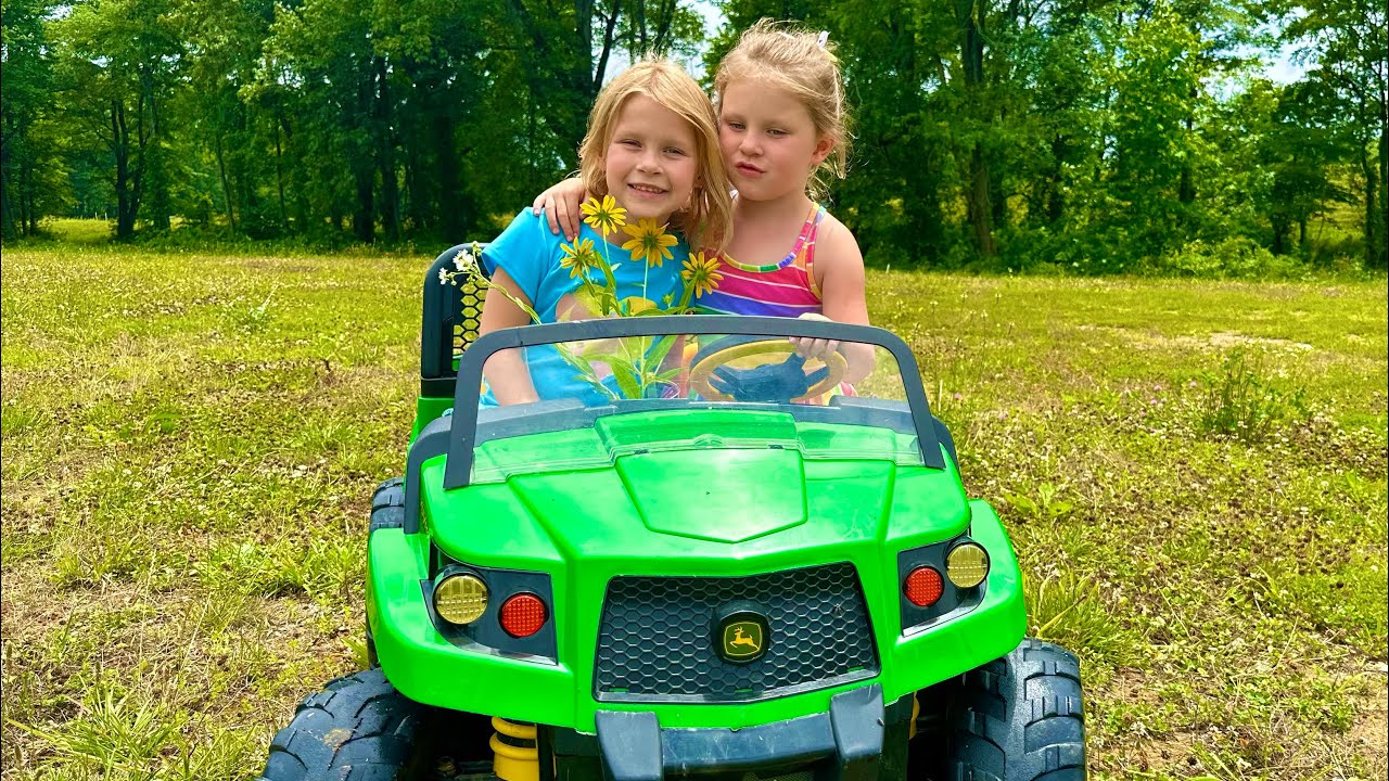 Alex and Mia driving John Deere Gator Vehicle for Kids