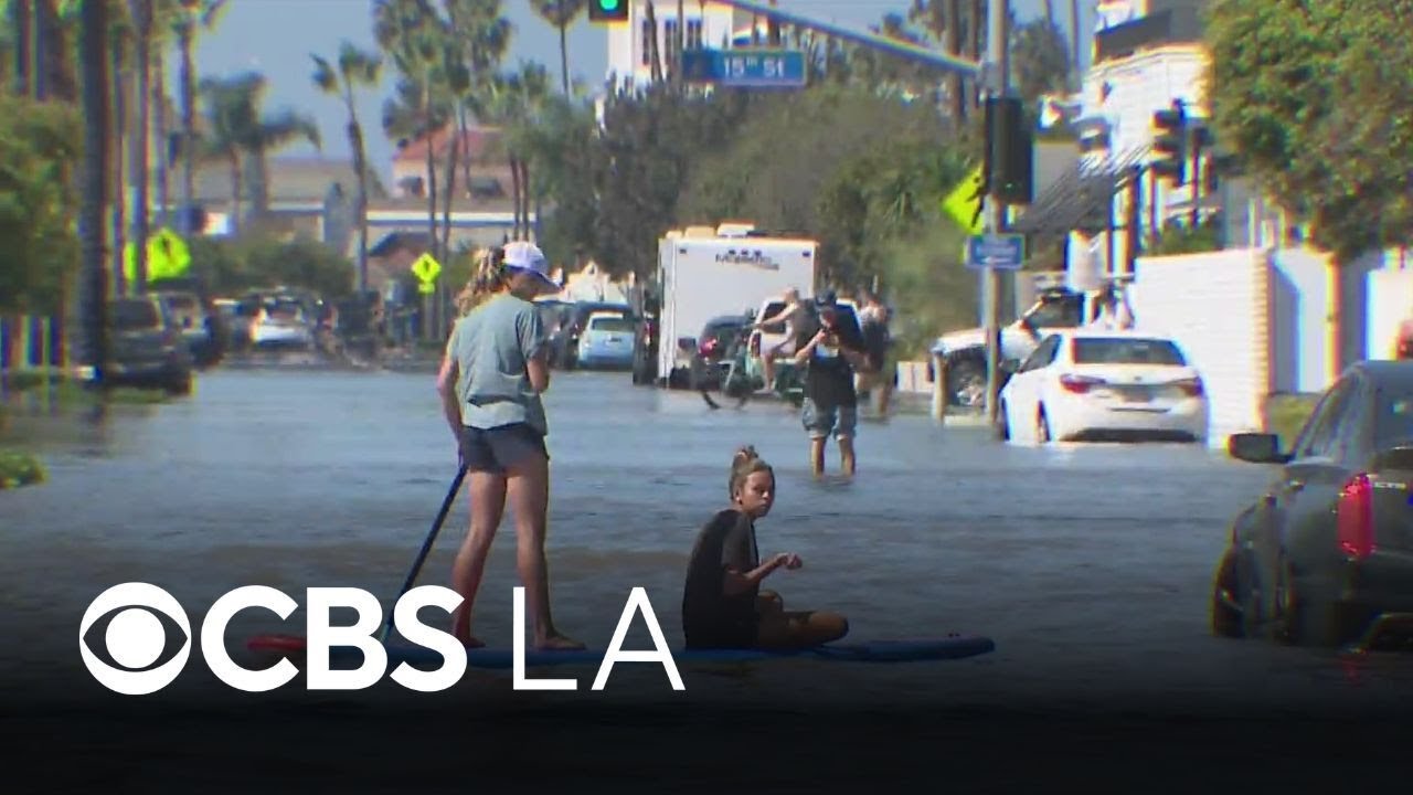 Coastal flooding turns streets into rivers in Newport Beach