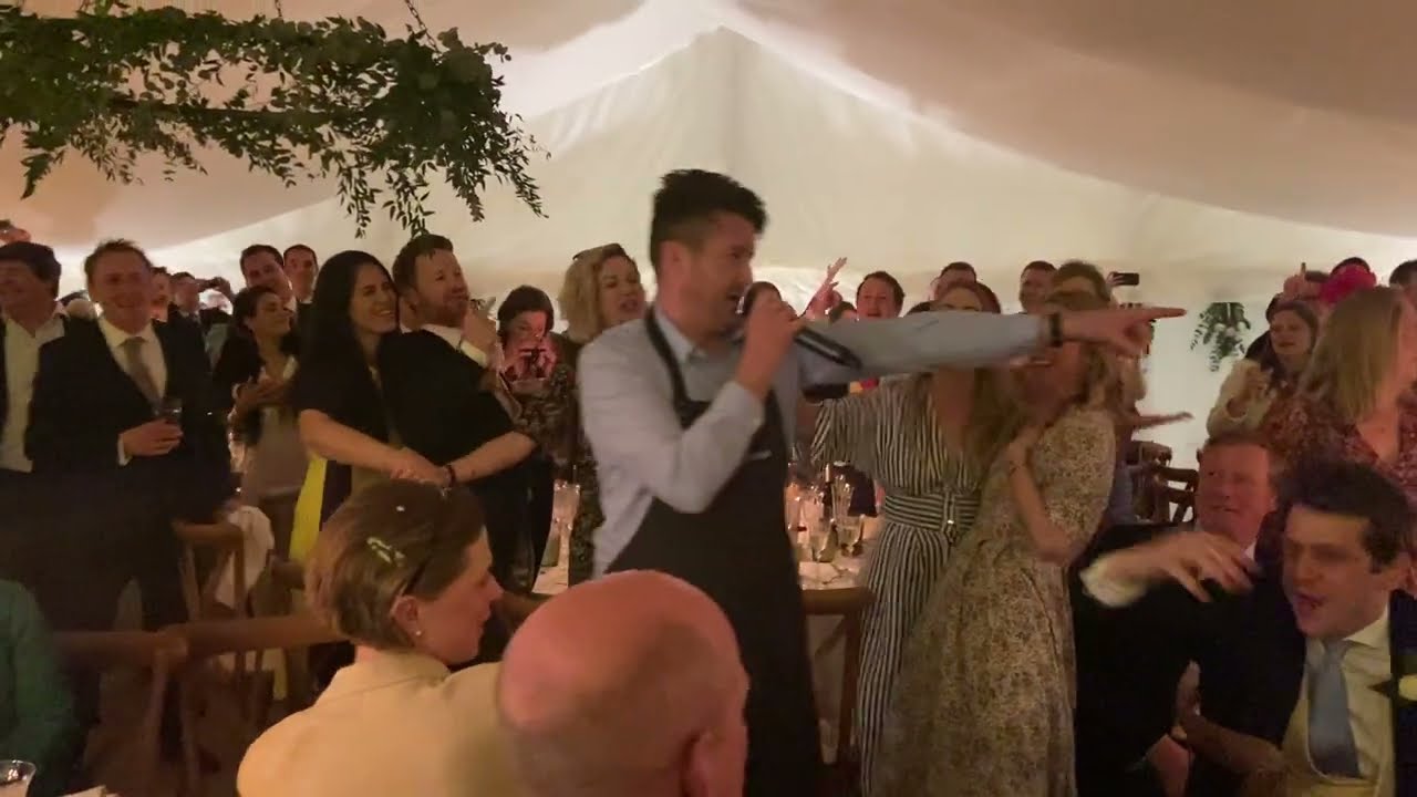 'Your Song' - The Singing Waiter Masters marquee wedding
