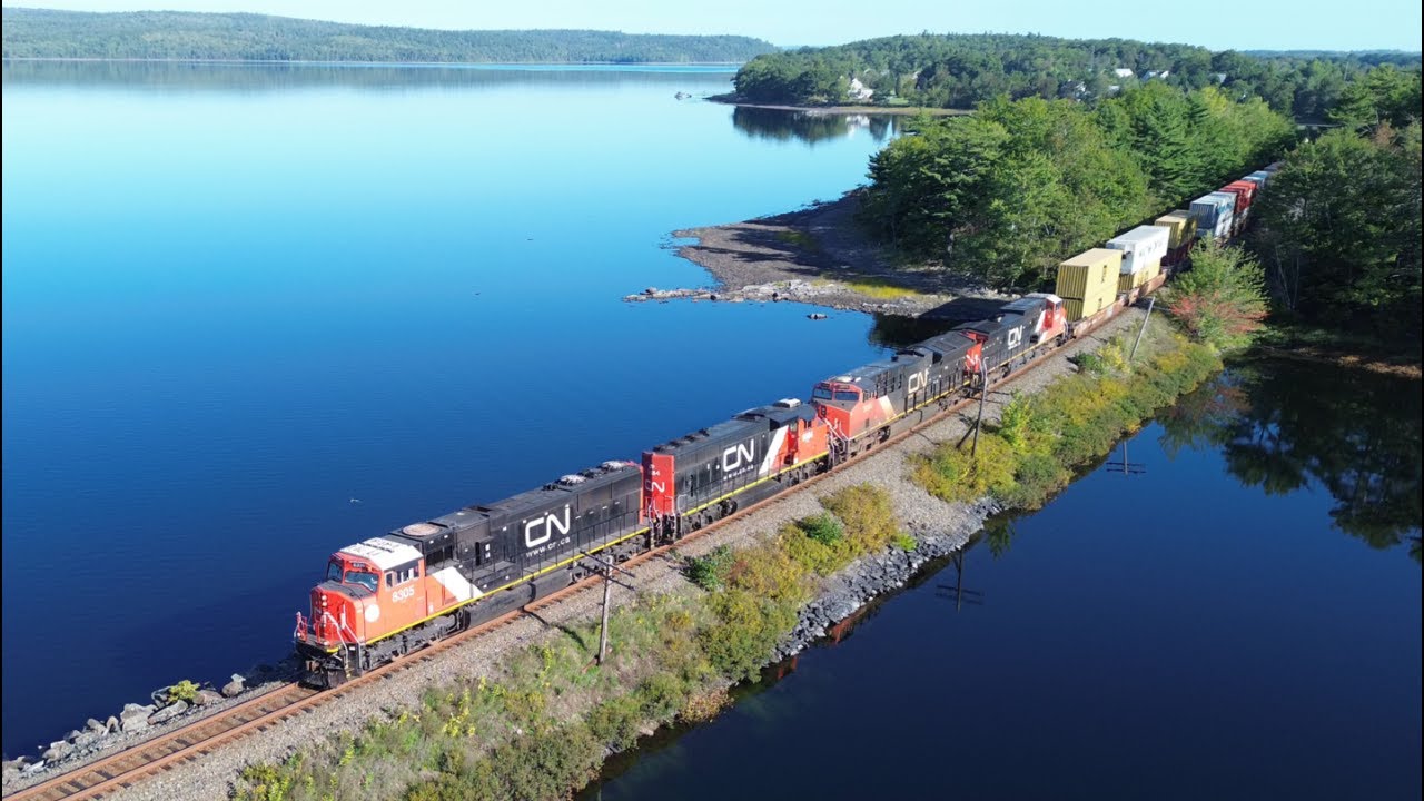 Awesome Aerial 4K View! SD75IACC 8305 Leads a Long Stack Train CN 120 w/DPU pass Grand Lake, NS