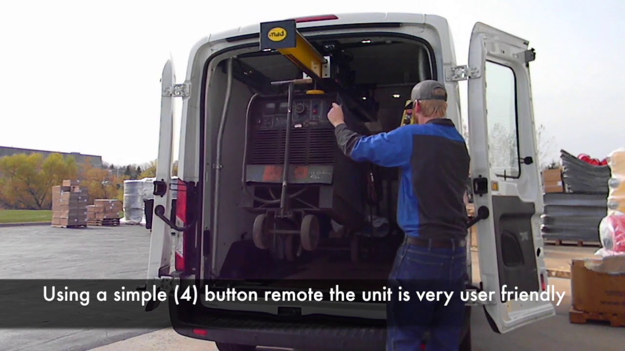 Ford Transit Medium Roof van using the MAD EasyLoad Hoist to transport large miller welder easily