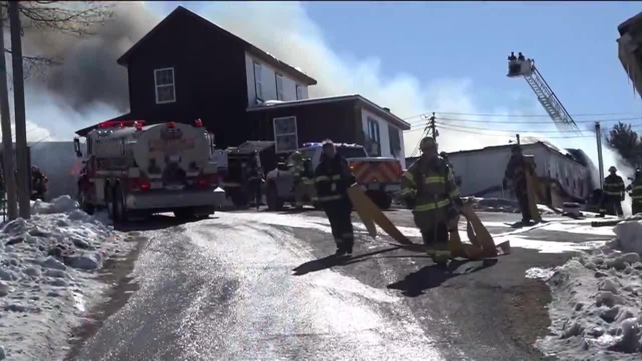 Fire crews work to contain fire at woodworking shop in Bridgewater