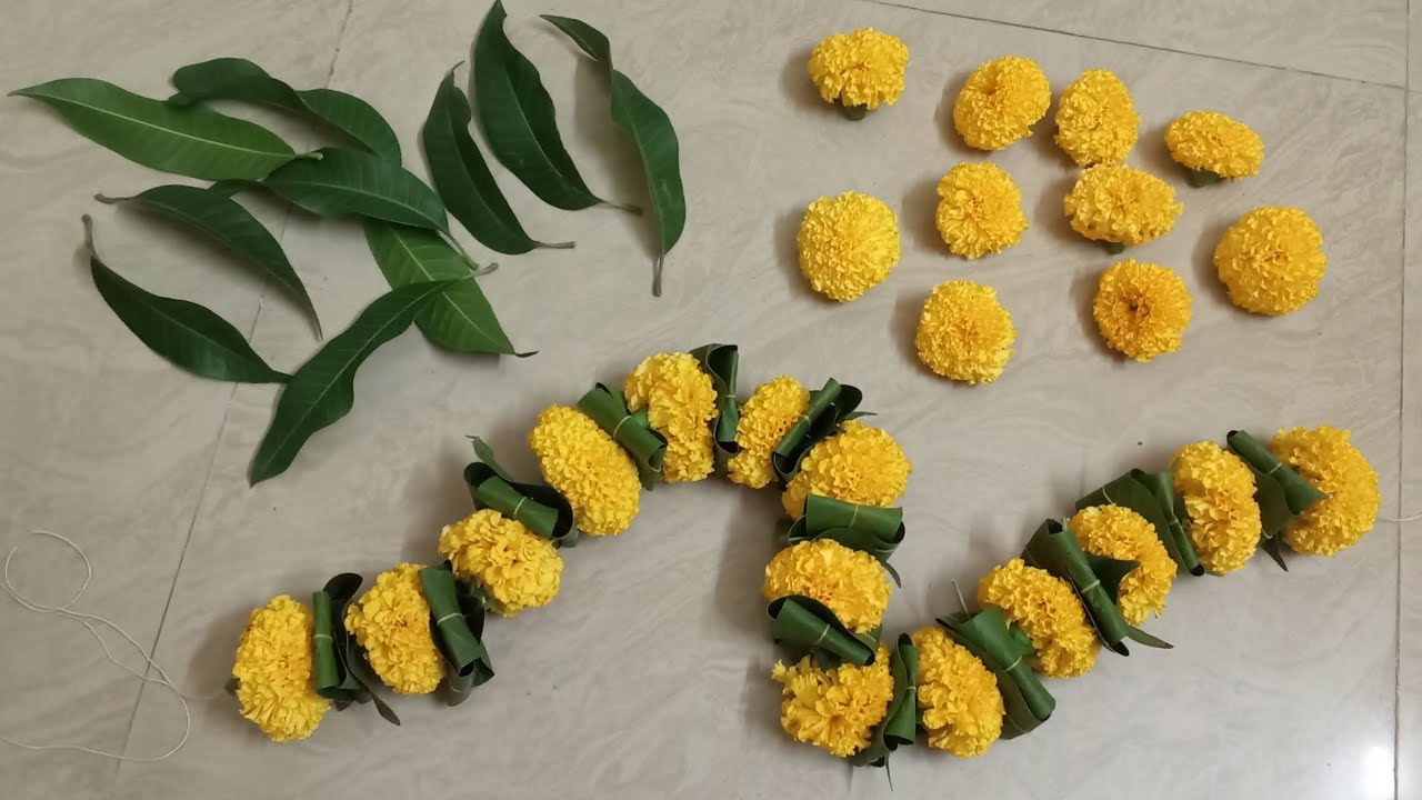 Mango leaves and flowers toran for door/how to make zhendu flowers toran | zhenduchya fulache toran
