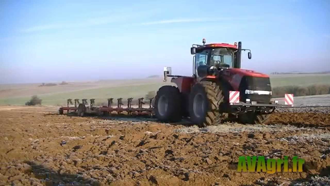 CASE IH STX 450 avec une charrue 10 corps en 2012