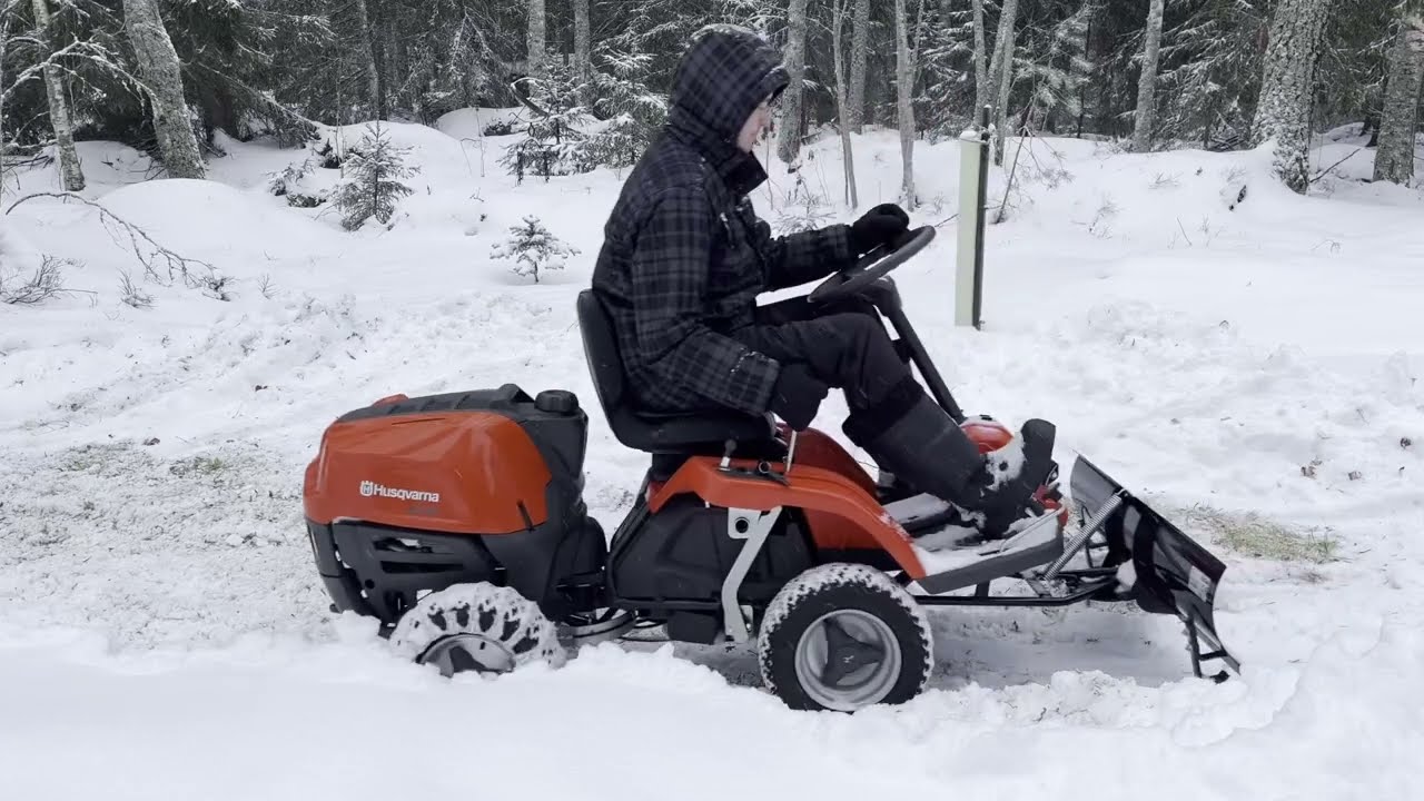 Plowing snow with husqvarna R112C