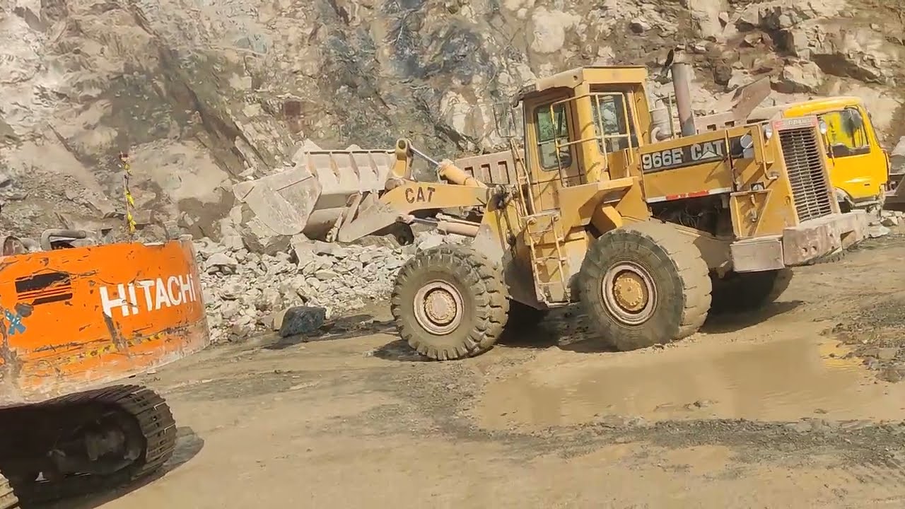 Big Caterpillar Loader Loading Massive Stones into Dumper in Mountain #mountainbike #rockcrusher 