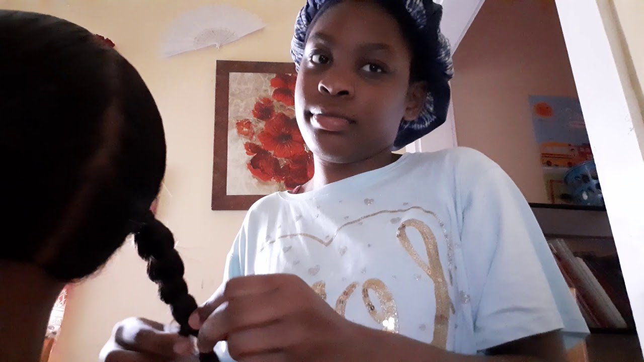 Doing slick back with two braids