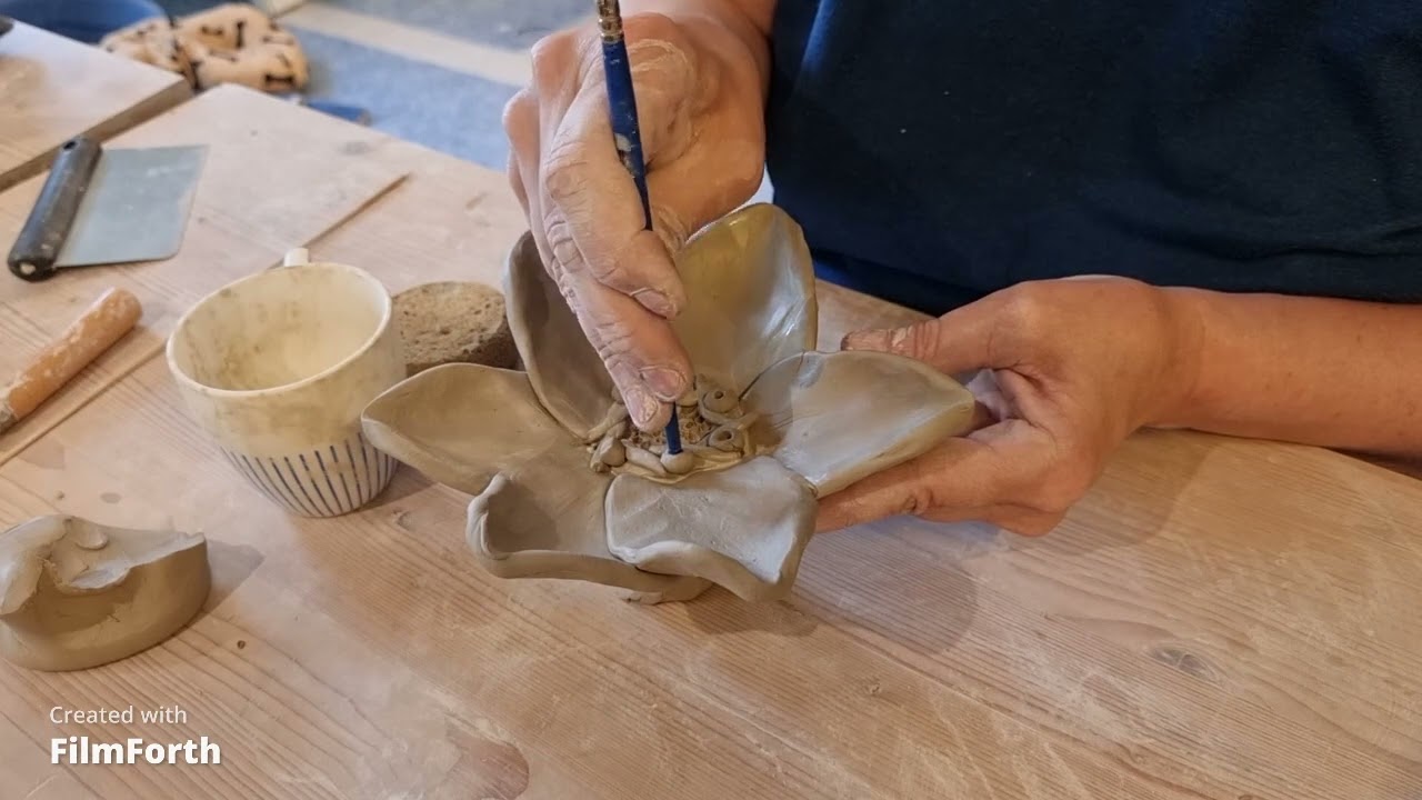 Decorate a clay flower.