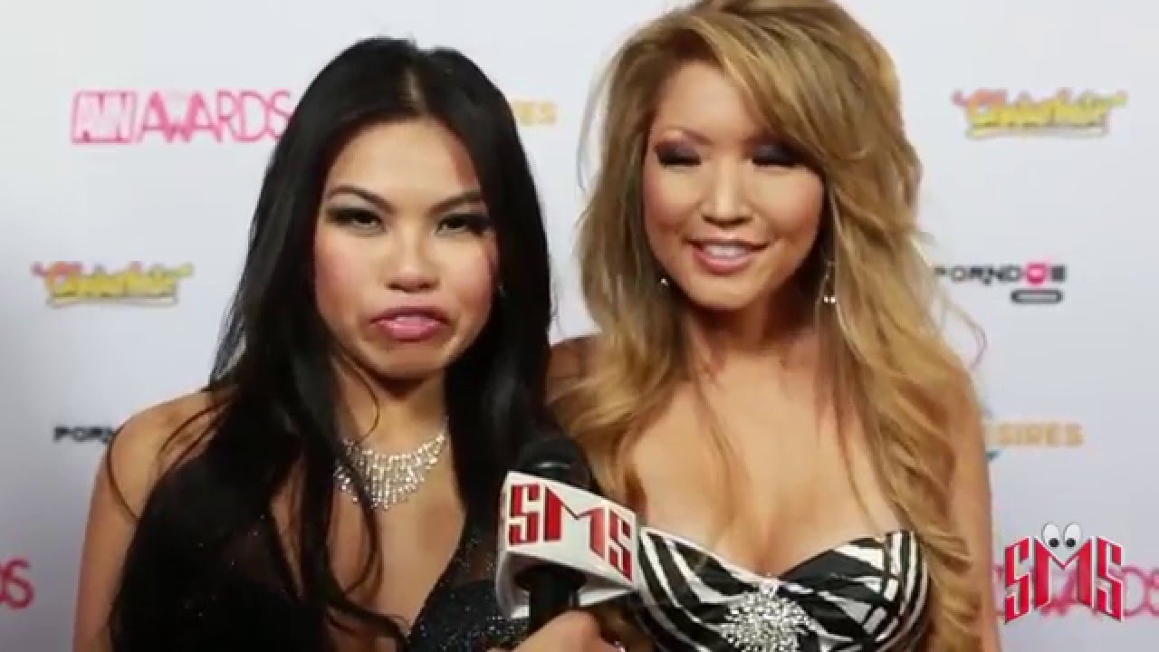 Cindy Starfall and Tia Kai Kiss on AVN Red Carpet