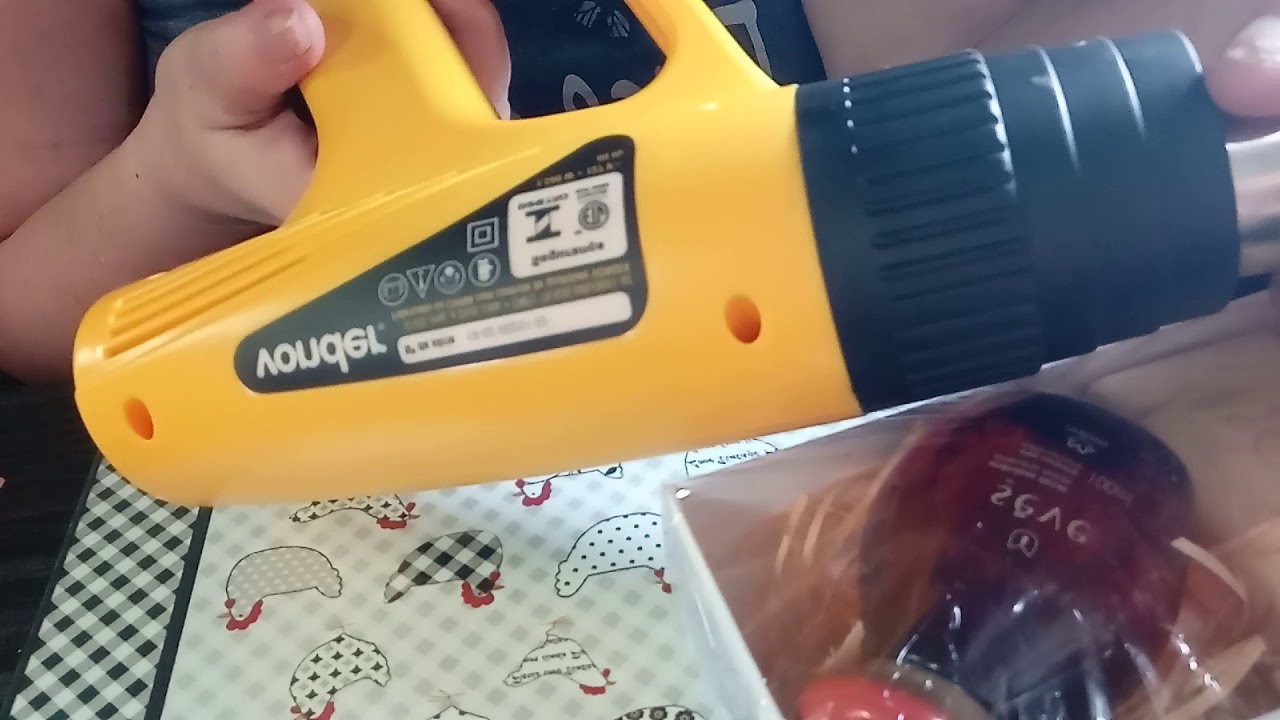 Plástico termoencolhivel e o soprador.