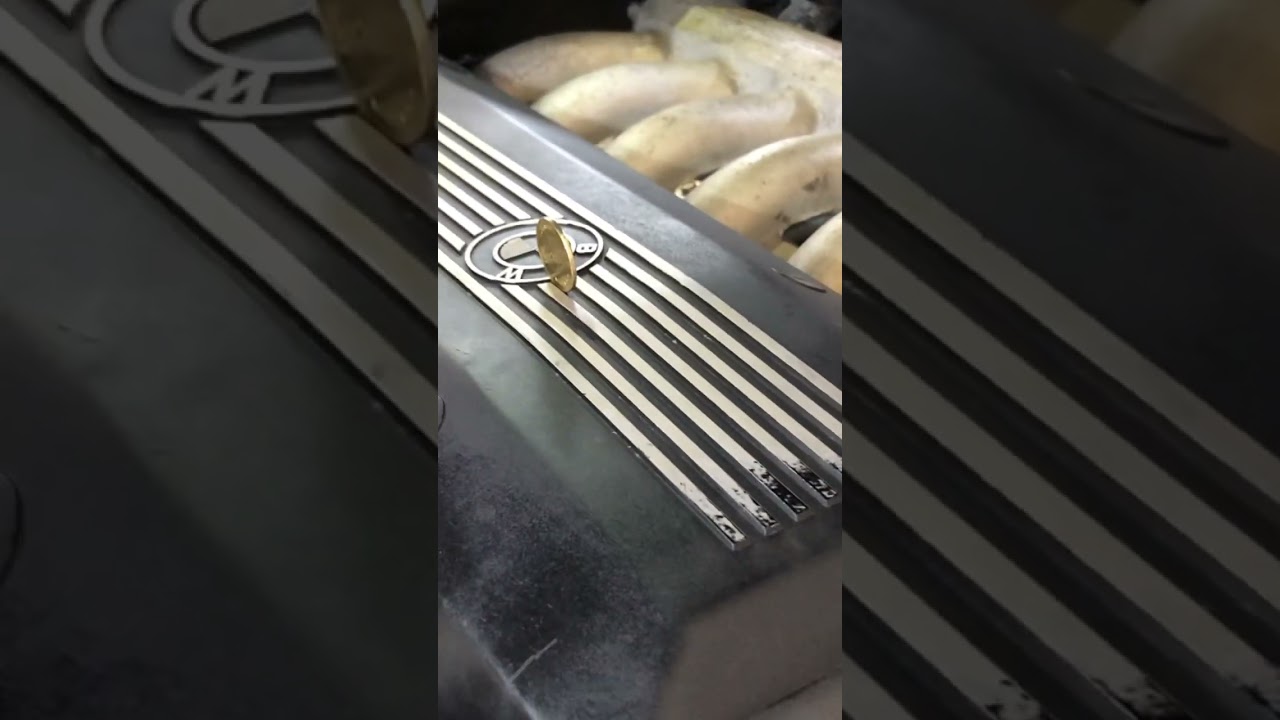 Balancing a coin on a running bmw V12 engine! 