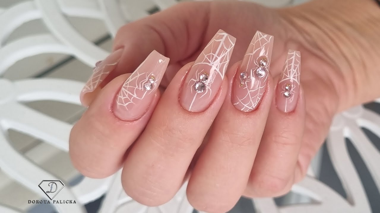 Buldier gel nail extensions with crystals spiders and web. Doing nails with not dominant hand