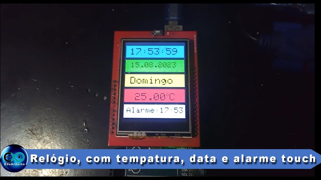 Relógio, com data, dia da semana, temperatura e alarme com display touch.