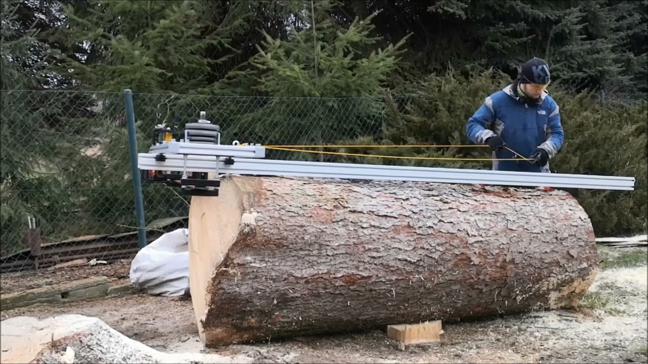 Cutting log with alaskan chainsawmill with Husqvarna 592 XPG