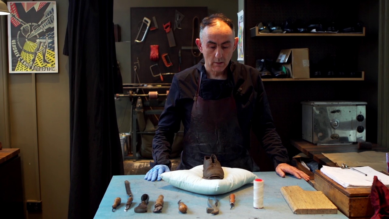 Shoemaker Andrew McDonald examines a convict shoe