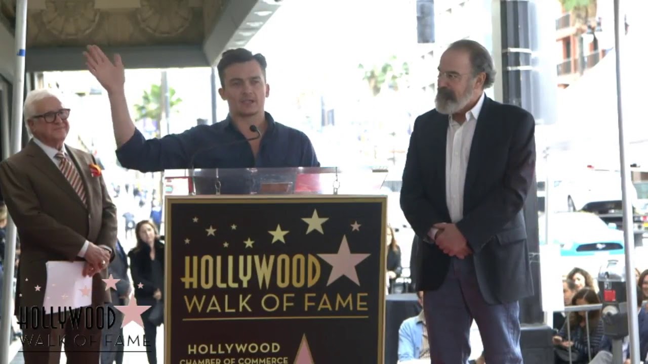 Rupert Friend speaking at Mandy Patinkin's Walk of Fame Ceremony