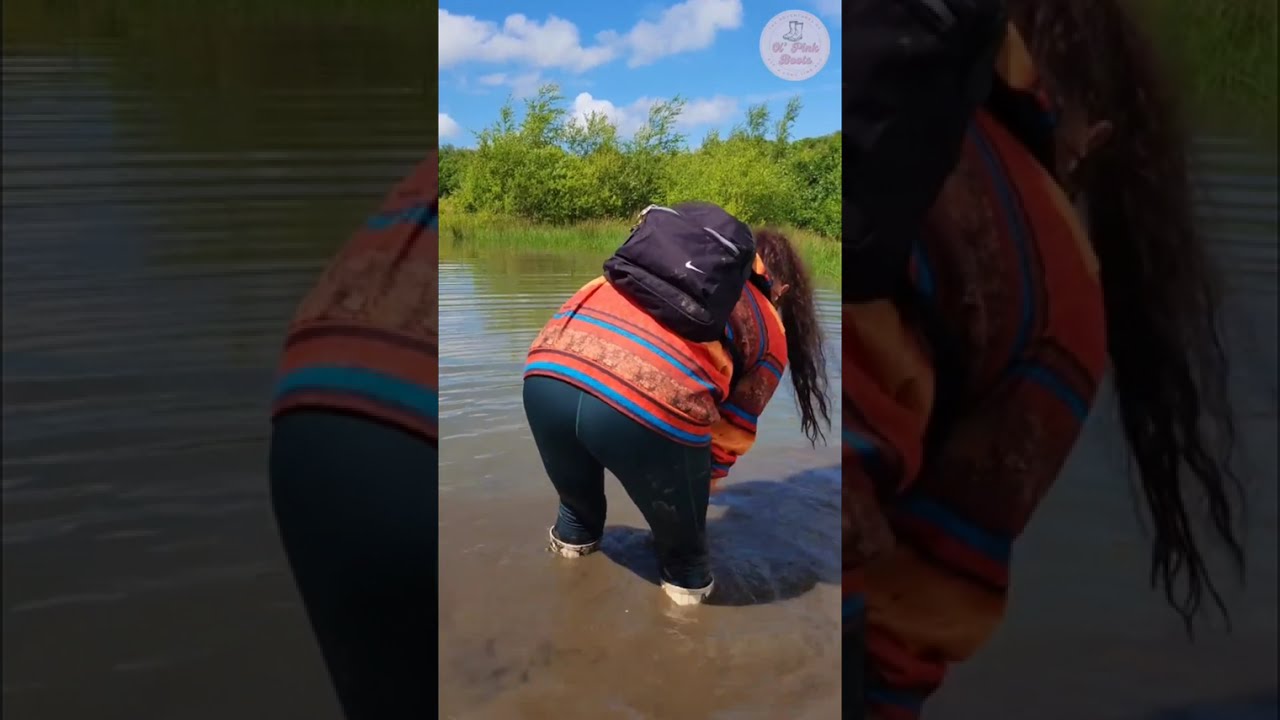 Cleaning my muddy Hunter boots in a pond