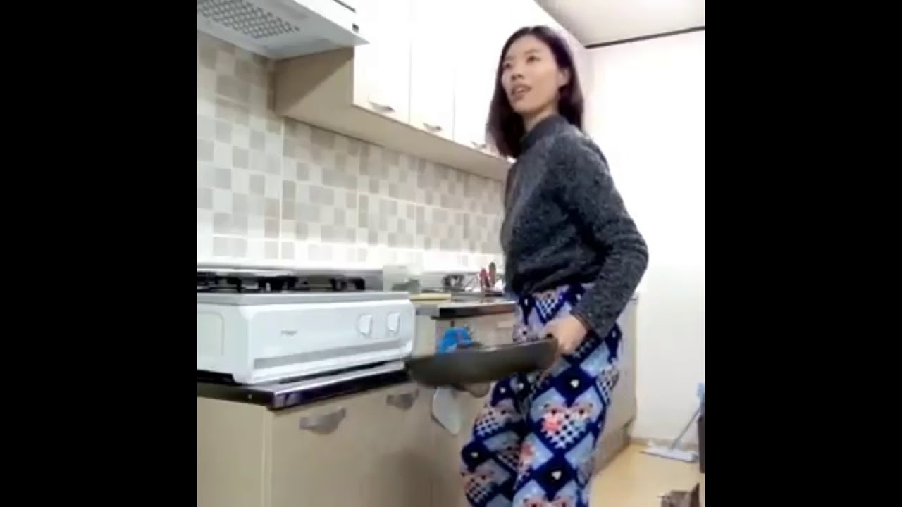 Asian lady dancing with cat