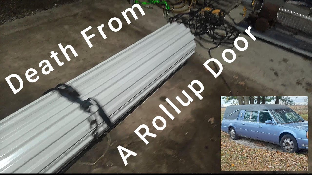 This door tried to kill me! #viral #rollupdoor #misadventures #diy #steelbuilding