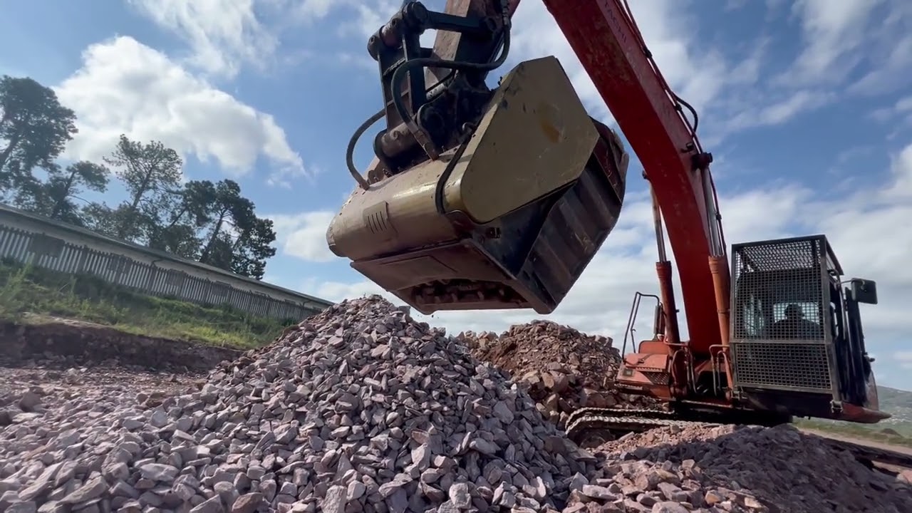 Excavtor CRUSHER BUCKET Attachment eating ROCKS! 
