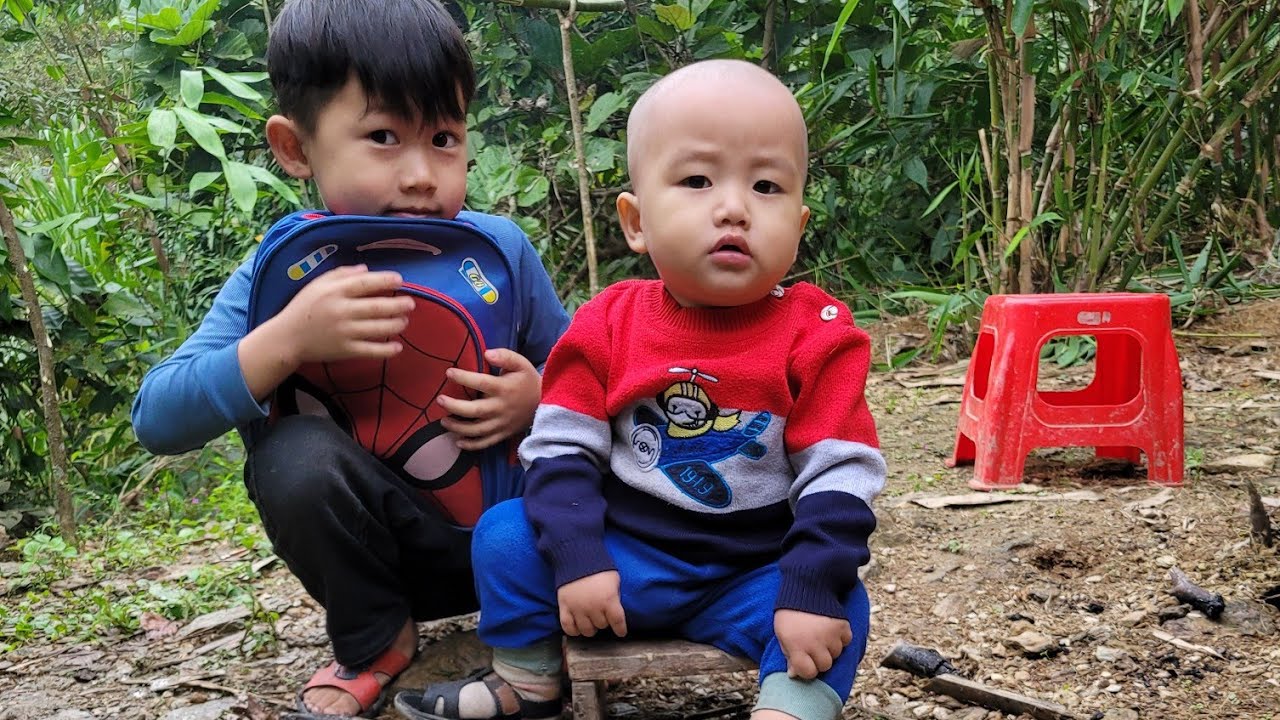 The woman bought books to prepare her two children for school, and cut the younger child's hair.