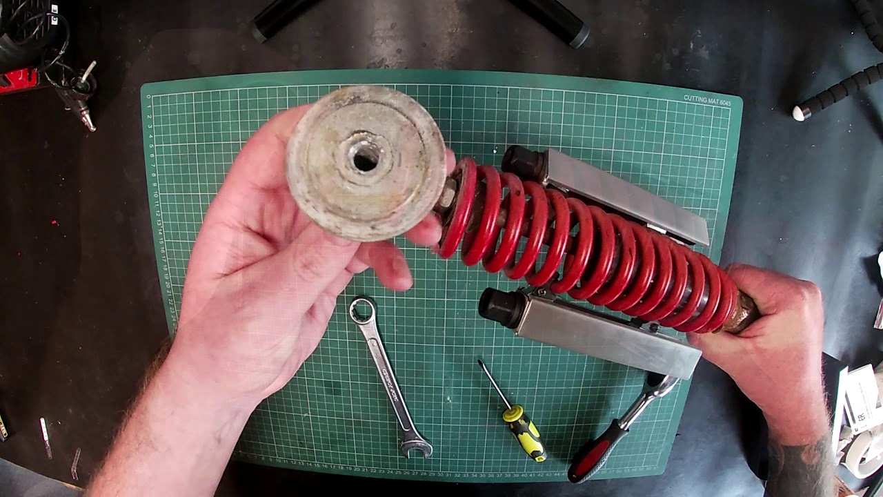 How to remove ATV coil springs