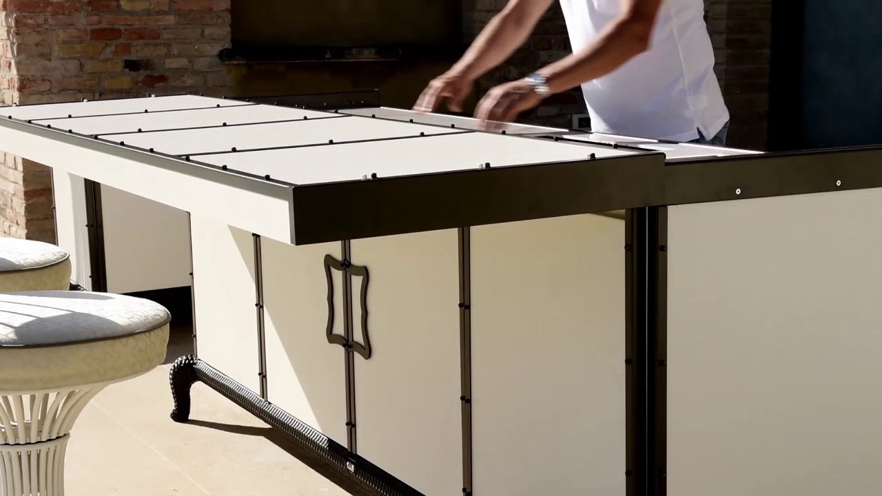 Luxury Outdoor Kitchens by Samuele Mazza: Linear kitchen with sliding cover