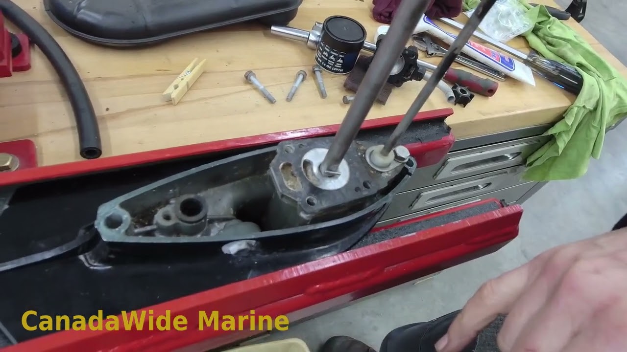 How to inspect and replace the water pump impeller in a Mercury 4hp outboard motor.