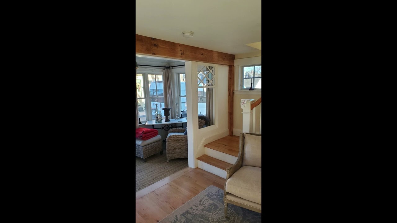 Entry expansion and faux beam with accent window