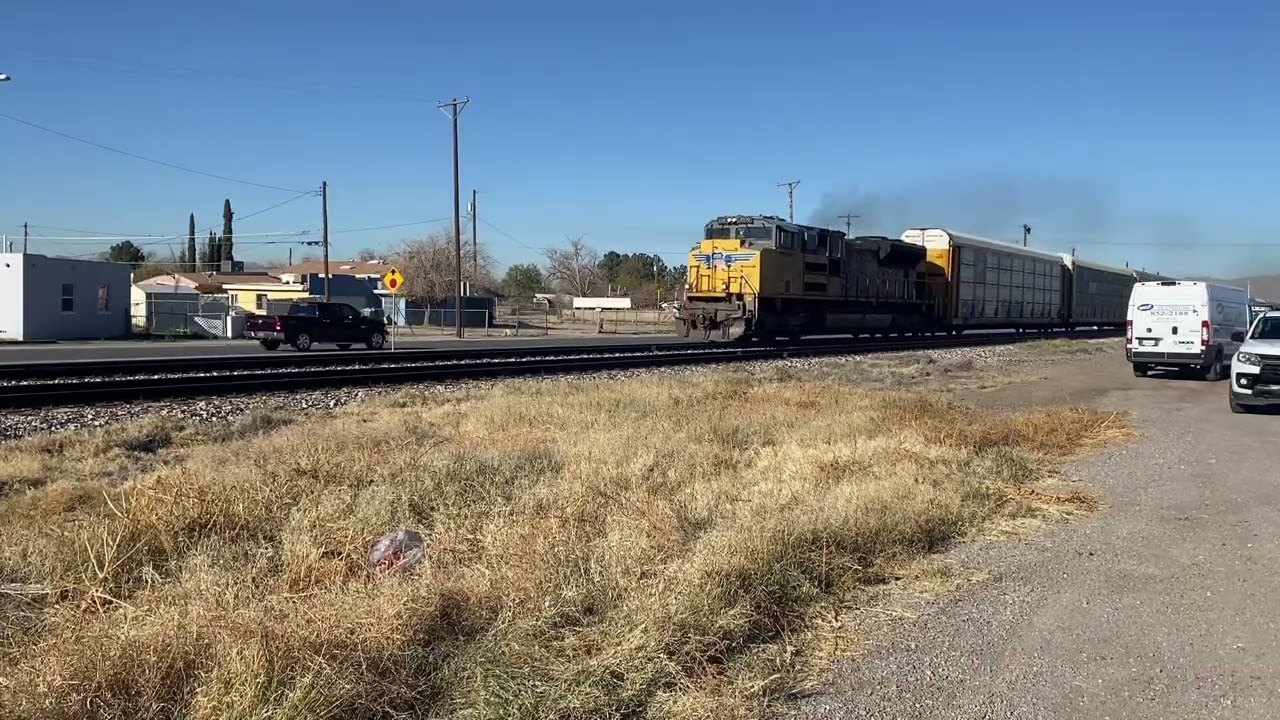 Lonely locomotive hauls heavy auto rack train!