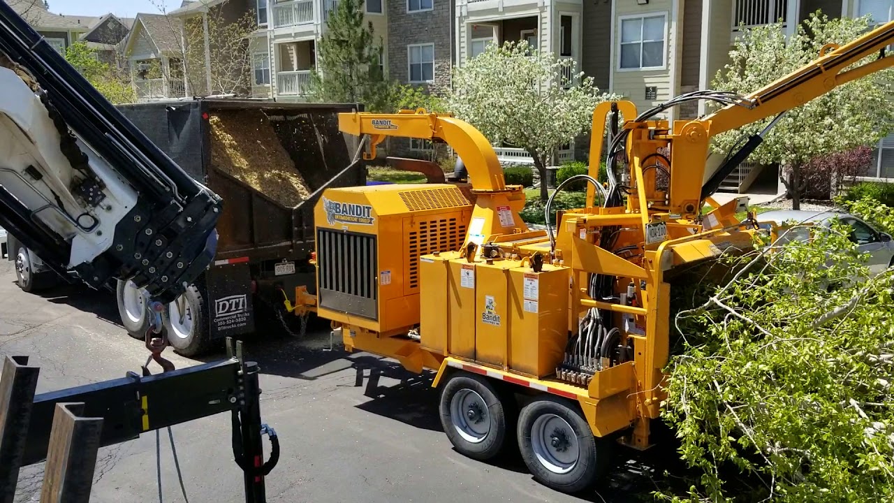 Huge Chipper Eats 3,000lb Tree in 1 minute 45 Seconds.