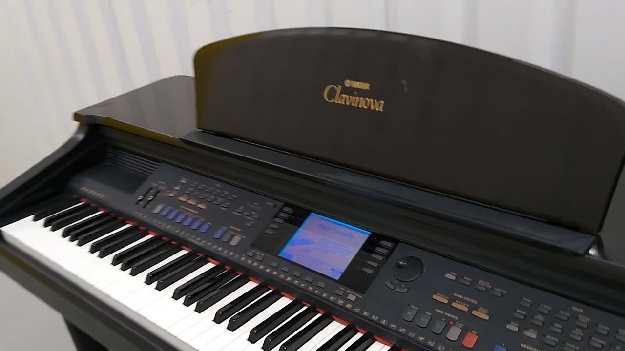 Yamaha Clavinova CVP-107 digital piano and stool in glossy dark rosewood. stock number 22173