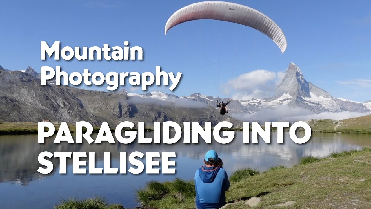 Mountain sports photography. Paragliding into Stellisee, Zermatt