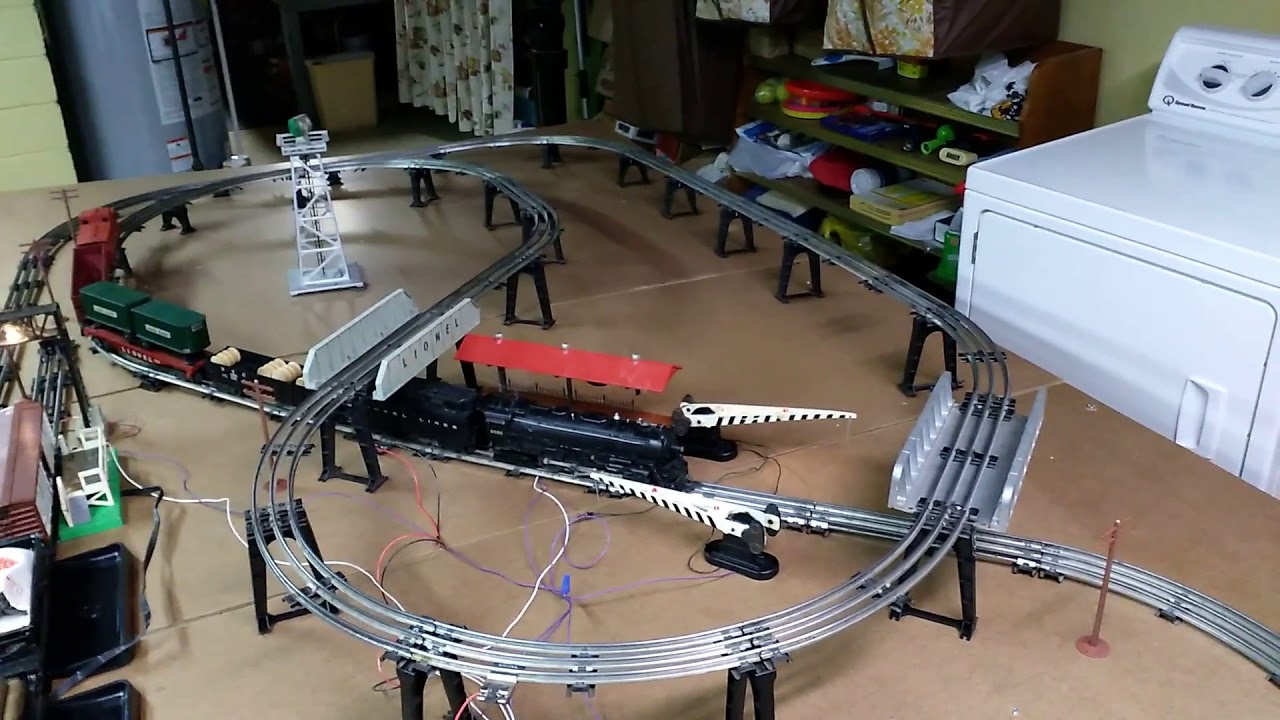 Vintage postwar Lionel 5x9 elevated train set with operating cars and accessories for sale